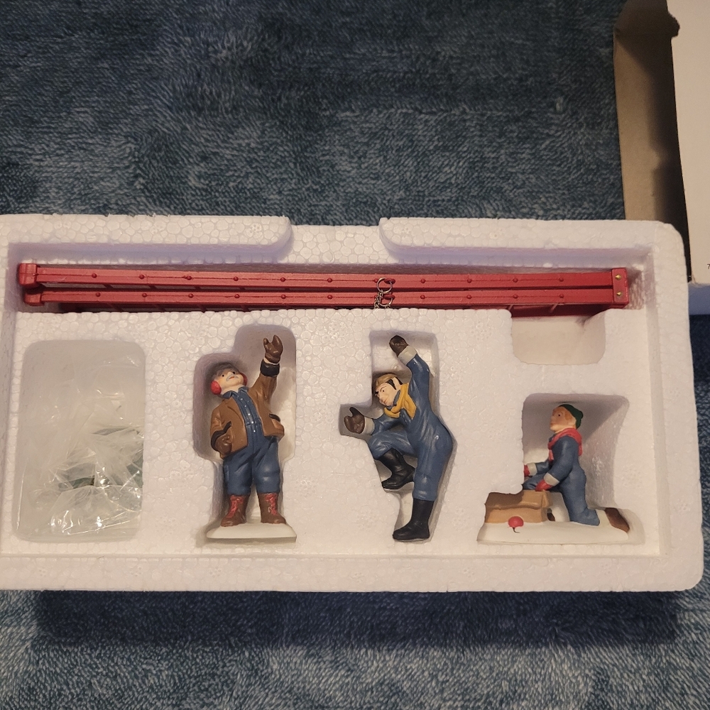 The Heritage Village Collectio. Set of Three Figurines with Red Accessory